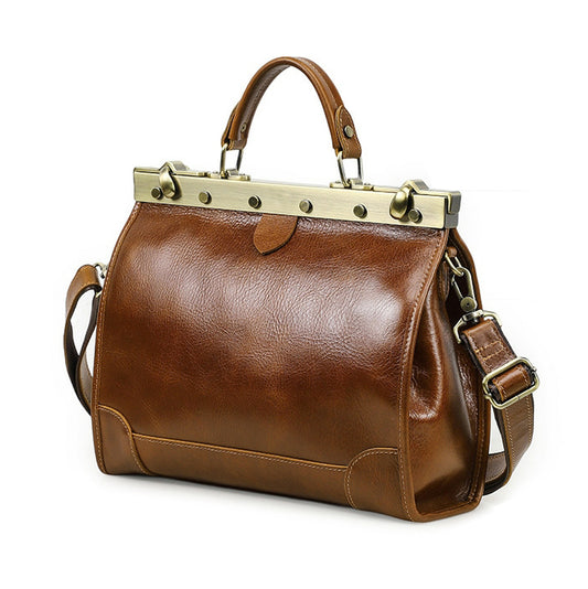 Brown leather crossbody bag with handle and adjustable strap, elegant design.