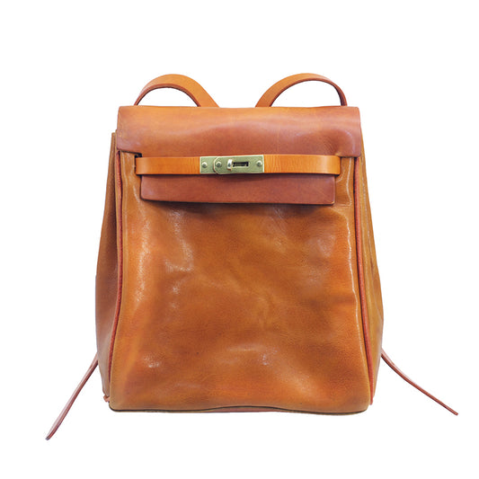 Stylish vegetable tanned leather backpack for women, small rucksack featuring a unique clasp, perfect for casual outings.