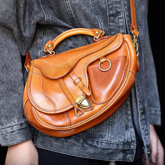 Saddle Bag Leather Crossbody, Italian Genuine Leather Should Bag, Unisex, More Handmade, 11in Length -i7bags worn by a person.