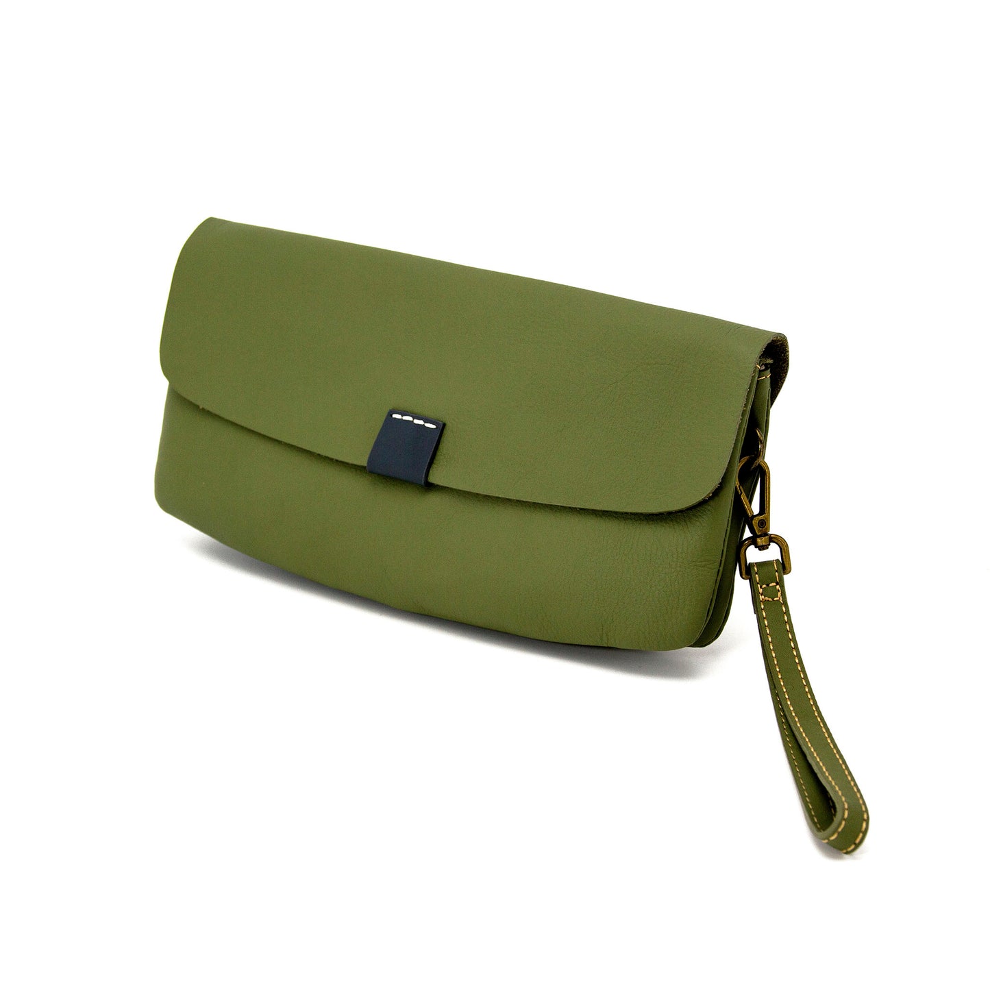 Olive green full-grain leather clutch bag with wristlet strap, featuring a navy blue tab and brass hardware.