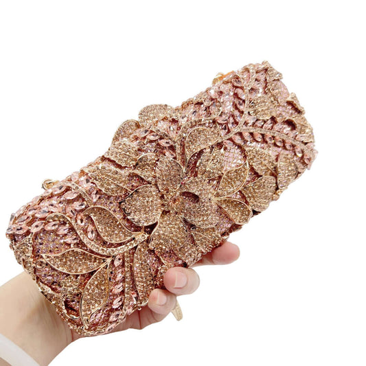 Gold Rhinestone Evening Clutch held in hand, showcasing intricate floral design and sparkling crystals for wedding parties.