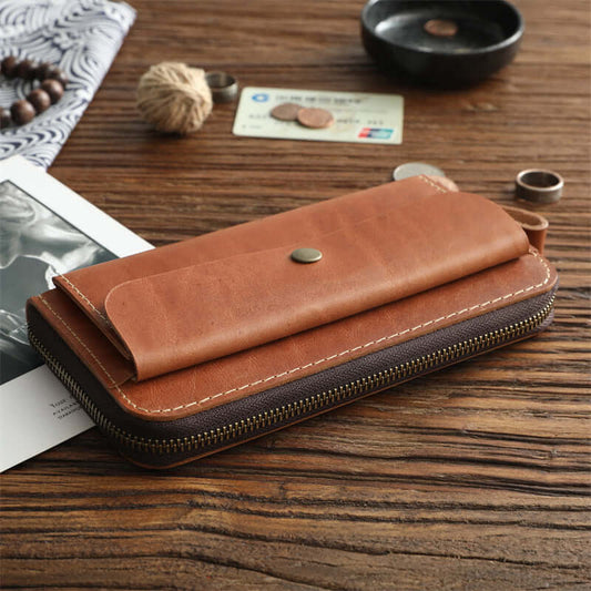 Full Grain Leather Zip Around Wallet Card Holder Phone Organizer in brown leather on a wooden surface.