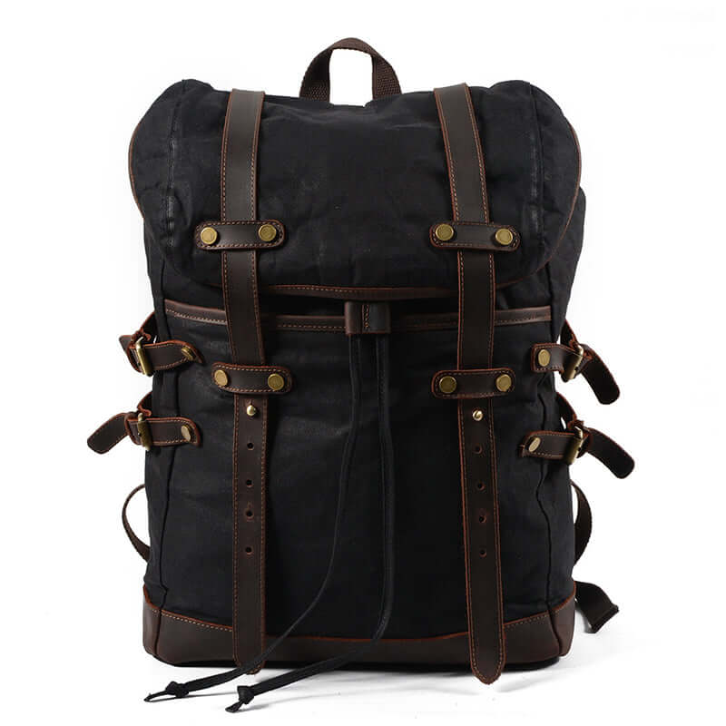 Canvas Backpack Men Waterproof Travel Rucksack Outdoor Bag 17.7in in black color with leather accents.
