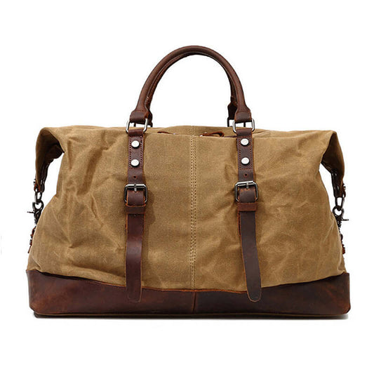 Large Waxed Canvas Travel Duffel Bag Leather Travel Duffle Luggage in khaki with brown leather accents.