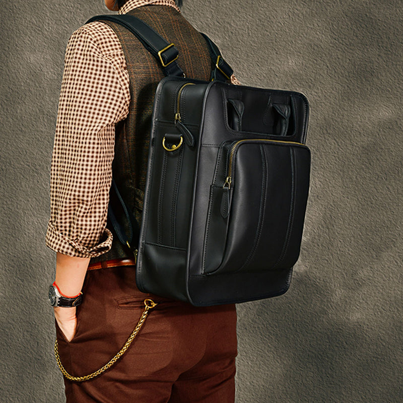 Black leather laptop backpack on a man, showcasing spacious design and stylish appearance.