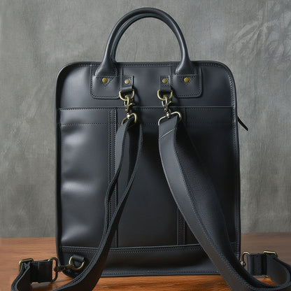 Stylish leather laptop bag with dual handles and adjustable strap, perfect for men to carry a 15-inch laptop.