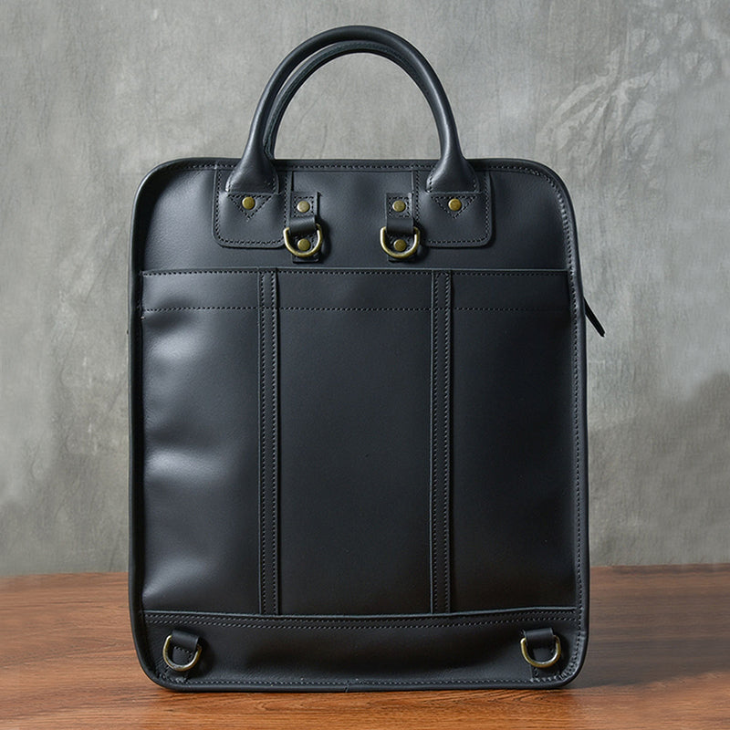 Stylish black leather laptop bag with top handles, ideal for men and 15-inch laptops, showcasing minimal design.