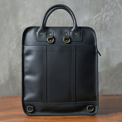 Stylish black leather laptop bag with top handles, ideal for men and 15-inch laptops, showcasing minimal design.