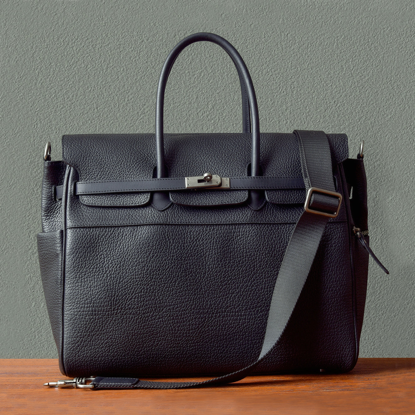 Mens leather work bag in black with dual handles and shoulder strap, perfect for business use.