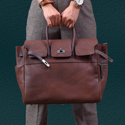 Mens brown leather work bag held by a person, featuring dual handles and a sleek design, perfect for business and daily use.