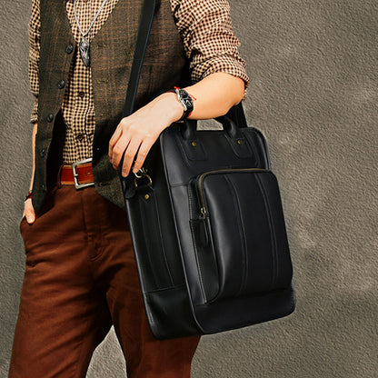 Man holding a stylish leather laptop bag, perfect for laptops up to 15 inches, featuring a sleek design and adjustable strap.