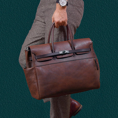 Mens leather work bag held by a person, stylish business tote with brown finish.
