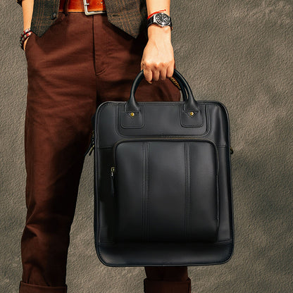 Stylish leather laptop bag held by a person, designed for 15-inch laptops, perfect for men.