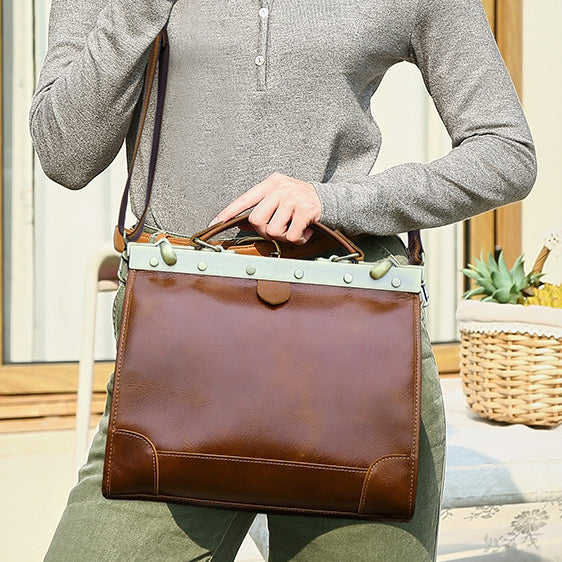 Brown leather crossbody bag with mint green accents, perfect for stylish everyday use.