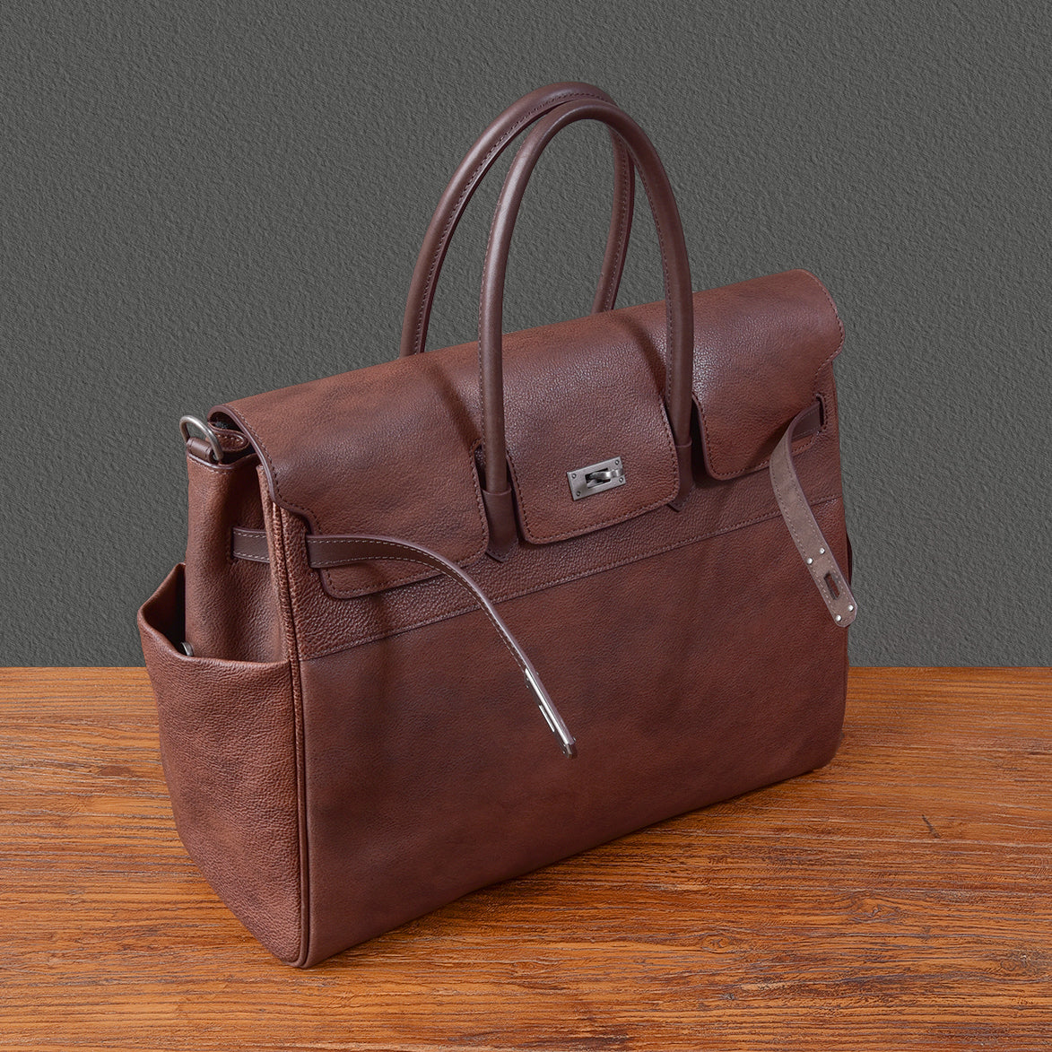 Mens brown leather work bag with handles, ideal for business use, featuring multiple pockets for organization.
