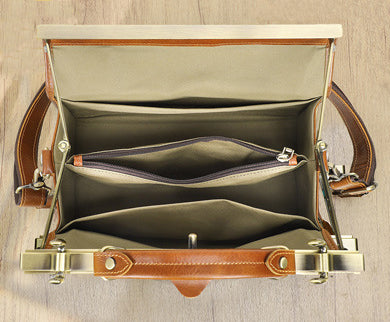 Interior view of a tan leather crossbody handbag showing spacious compartments and organized pockets.