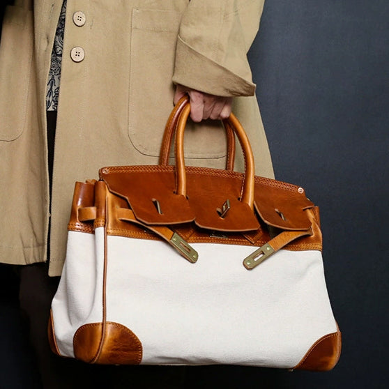 Canvas And Leather Handbags: Stylish unisex work bag featuring a blend of canvas and leather, suitable for everyday use.