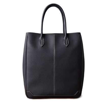 Large vertical black cowhide tote bag made of top-grain leather, ideal for laptops and everyday use.