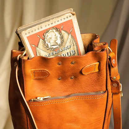 Italian Leather Bucket Bag Women with a book inside, showcasing a stylish design and practical storage.