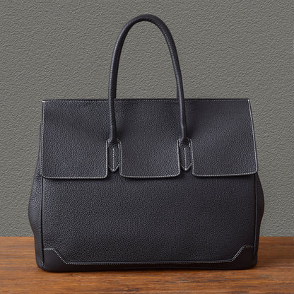 Elegant black leather work bag with structured design and top handles, perfect for professional use.