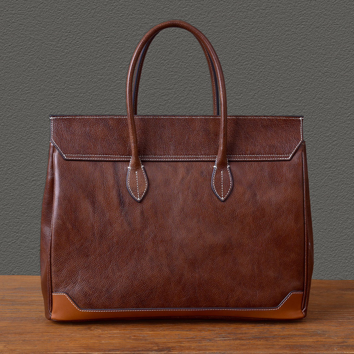 Top-grain leather large business tote bag in brown, measuring 15.7x12.6x6.3 inches, perfect for laptops.