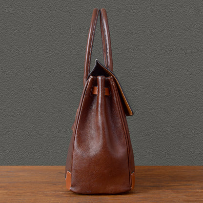 Back view of a brown top-grain leather large business tote bag, showcasing its stylish design and craftsmanship.