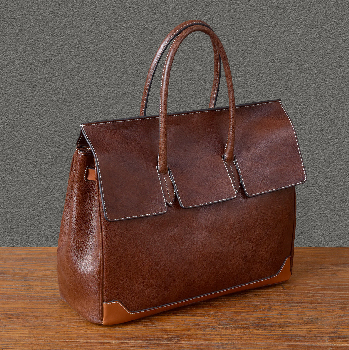 Top-grain leather large business tote bag in brown, measuring 15.7 x 12.6 x 6.3 inches, perfect for laptops.
