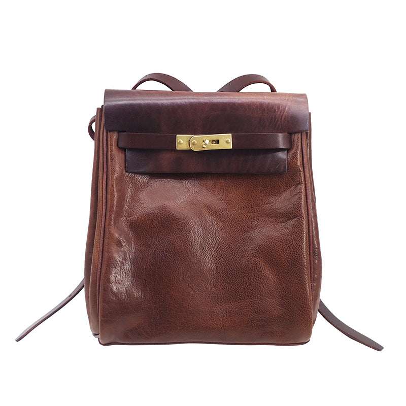 Leather Backpack Women, small rucksack in vegetable tanned brown leather with clasp closure and adjustable straps.