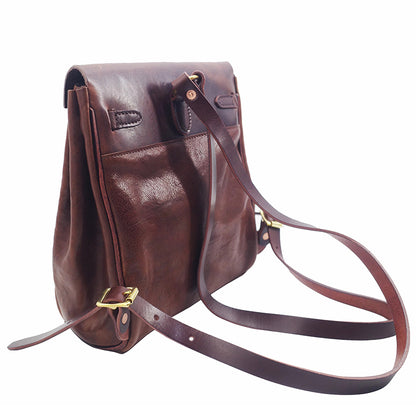 Brown vegetable tanned leather backpack for women, small rucksack with adjustable strap, stylish and durable.