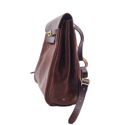 Side view of a Vegetable Tanned Leather Backpack Women, small rucksack with adjustable strap, showcasing rich brown leather.