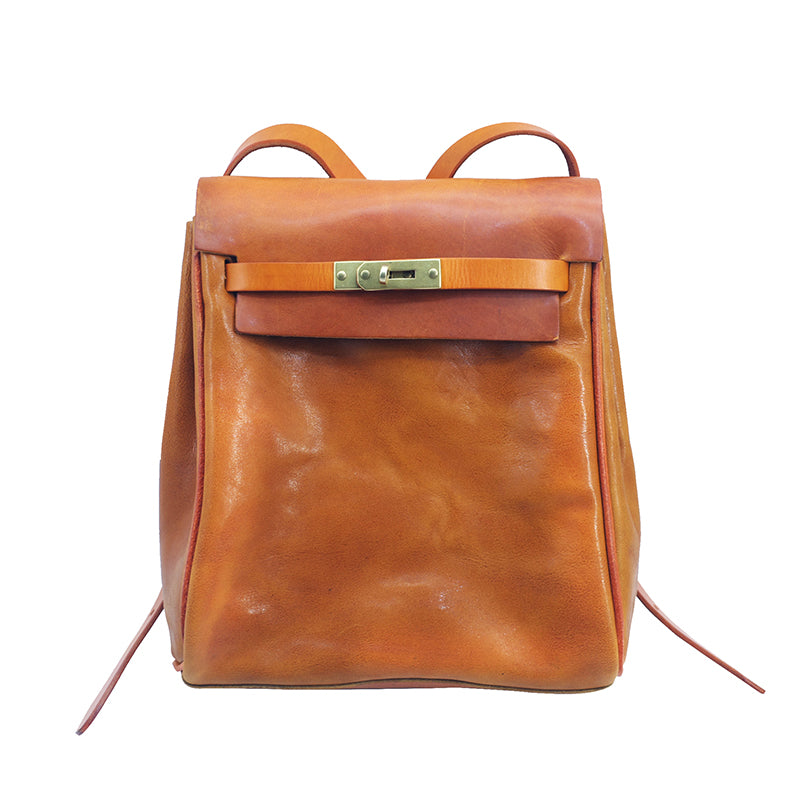 Stylish vegetable tanned leather backpack for women, small rucksack featuring a unique clasp, perfect for casual outings.