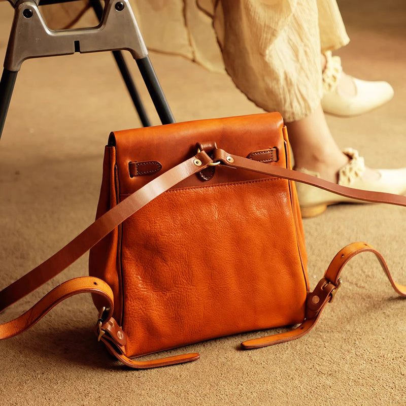 Vegetable tanned leather backpack women small rucksack featuring stylish design and adjustable straps.