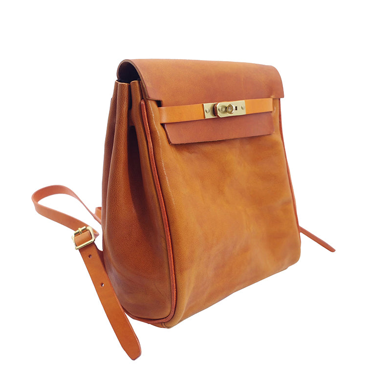 Vegetable tanned leather backpack women small rucksack with adjustable strap and elegant closure.