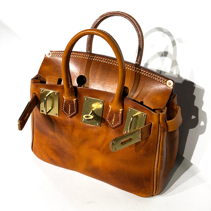 Handcrafted Italian Leather Crossbody Bag Women with gold hardware and unique design.