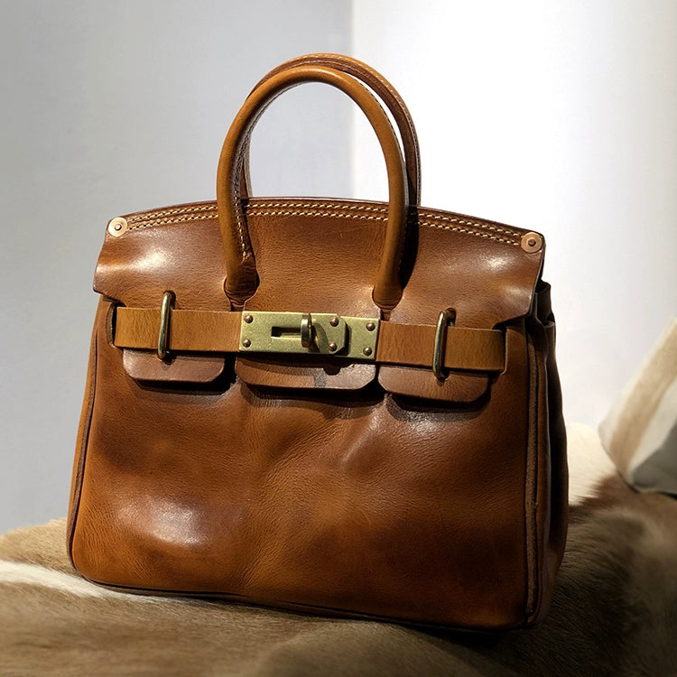 Handcrafted Italian Leather Crossbody Bag Women in brown with top handles and gold buckles, elegant and stylish.