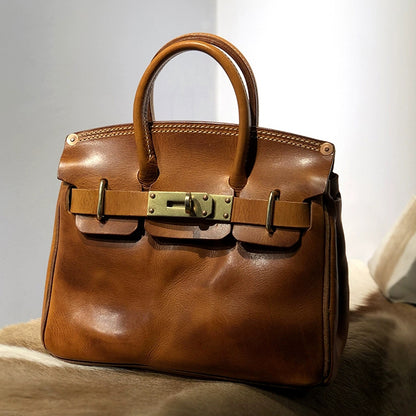 Handcrafted Italian Leather Crossbody Bag Women in brown with top handles and gold buckles, elegant and stylish.