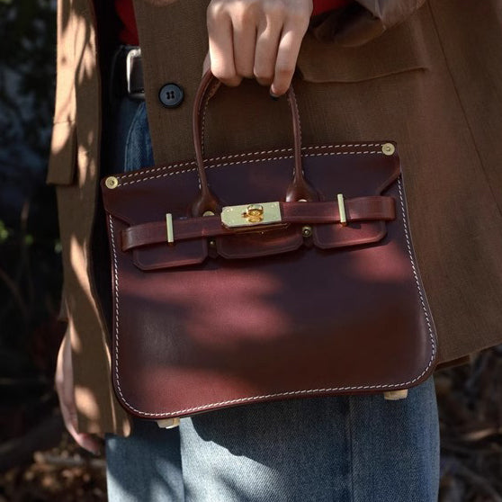Classic Italian Leather Crossbody Bag Women held by a person wearing a stylish outfit, showcasing elegant design and vibrant color.