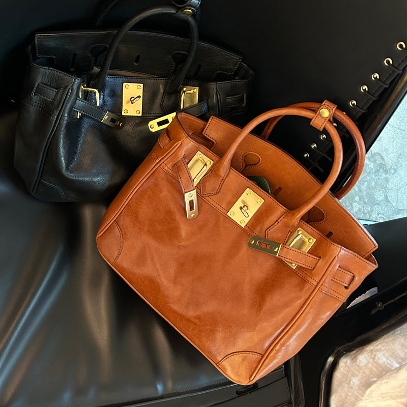 Genuine Leather Tote Bag Women in black and brown colors displayed on a black background.