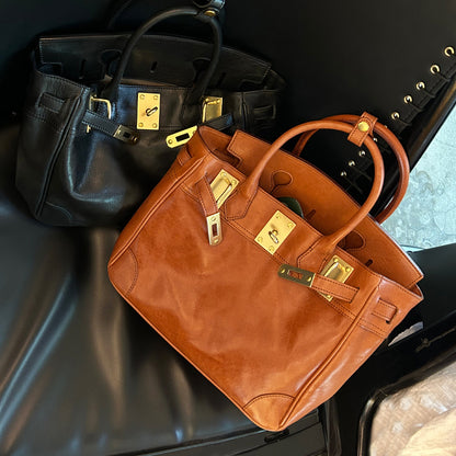 Genuine Leather Tote Bag Women in black and brown colors displayed on a black background.