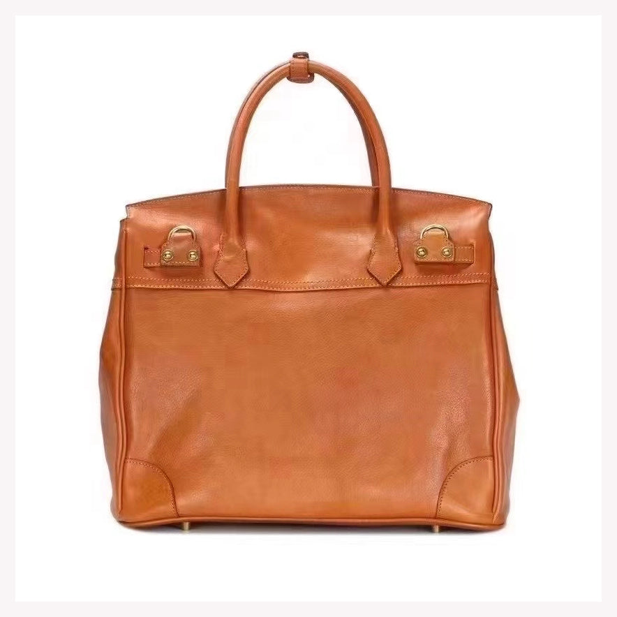 Genuine Leather Tote Bag Women in brown color, featuring sturdy handles and a spacious design.
