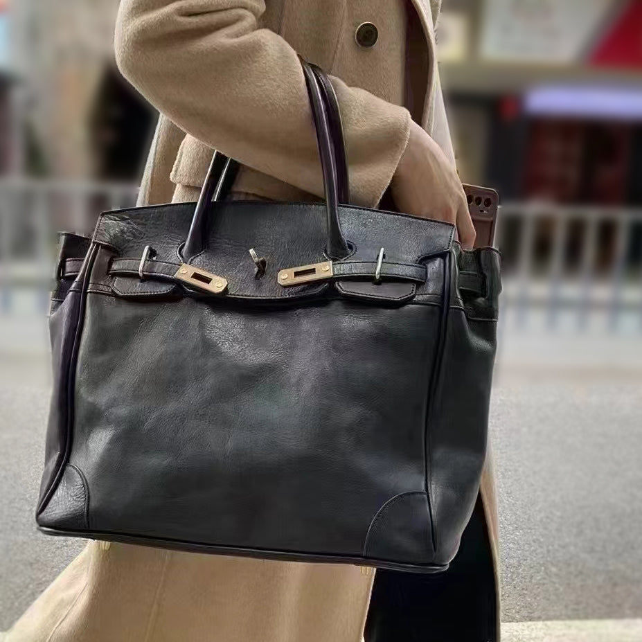 Genuine Leather Tote Bag Women being carried, showcasing its stylish design and spacious interior.