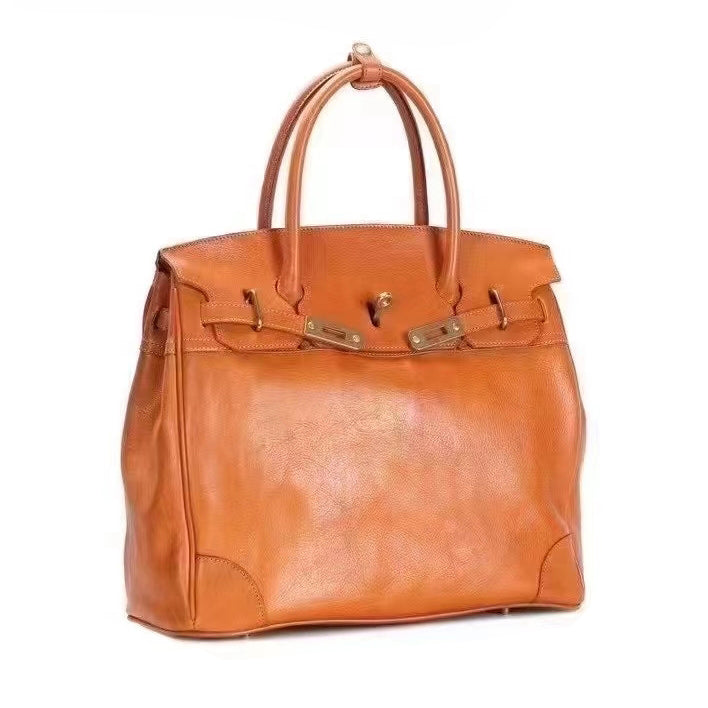 Genuine Leather Tote Bag Women in orange color, stylish large work bag with two handles.