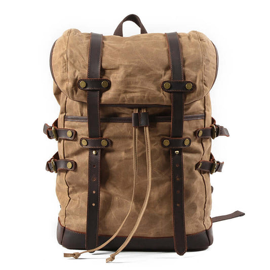 Canvas Backpack Men Waterproof Travel Rucksack Outdoor Bag 17.7in in khaki color with leather straps.