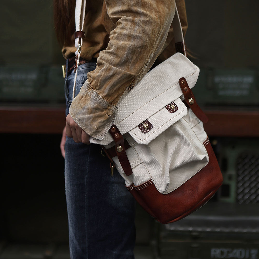 Canvas Crossbody Bag in Italian Leather Vintage Military Style on a person, showcasing its stylish durability and design.