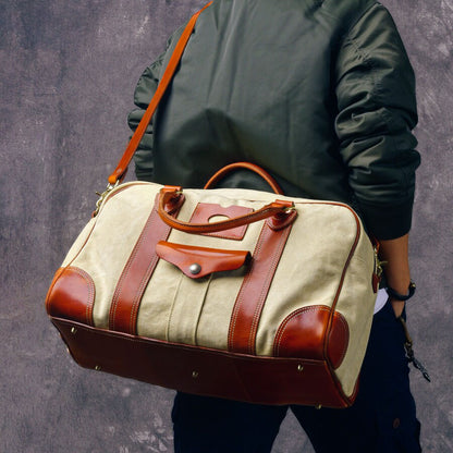 Canvas Duffle Bag Italian Leather Large Weekender Bag shown on a person wearing a jacket, showcasing its style and functionality.