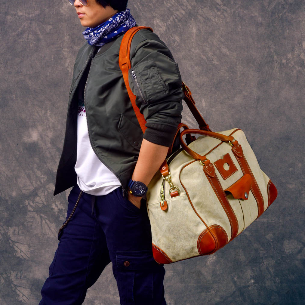 Canvas Duffle Bag Italian Leather Large Weekender Bag on a traveler showcasing style and functionality.