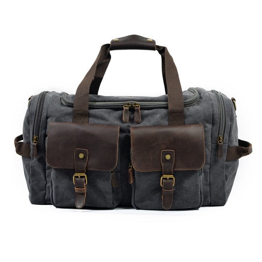 Large Canvas Leather Travel Bag 20.9in Crossbody Shoulder Duffel For Men in dark gray with leather straps and pockets.
