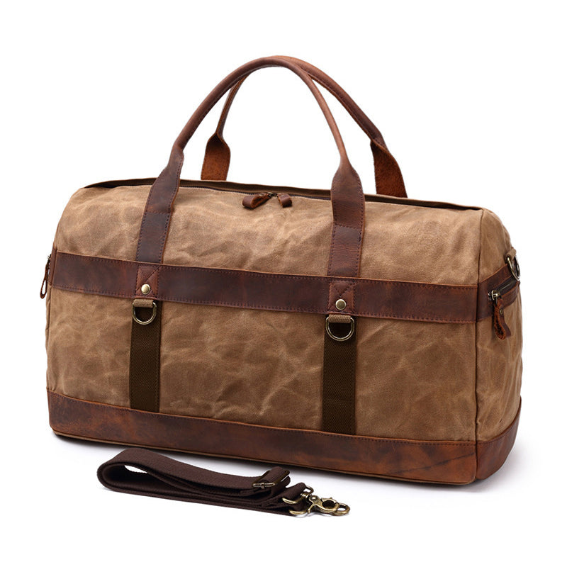 Canvas Leather Duffel Bag 22in Large Capacity Travel Gym Bag in brown with durable straps and adjustable shoulder strap.