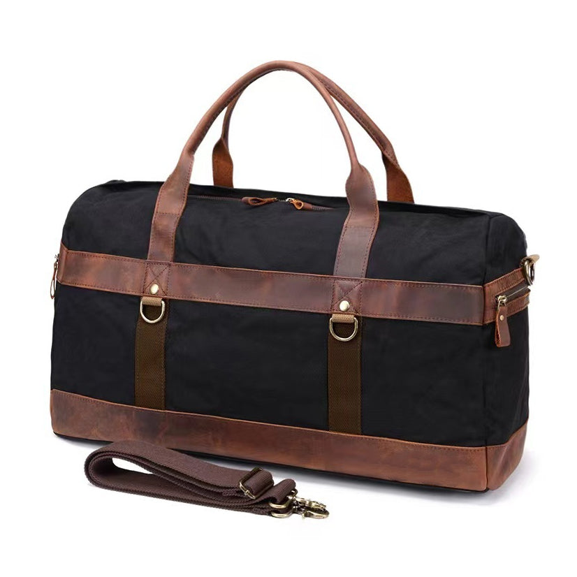 Canvas Leather Duffel Bag 22in Large Capacity Travel Gym Bag in black with brown leather accents and adjustable strap.