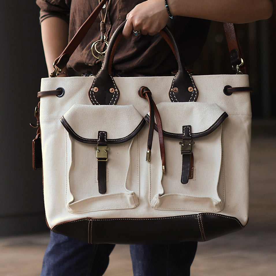 Large Canvas Leather Tote Bag featuring dual front pockets and sturdy leather handles.